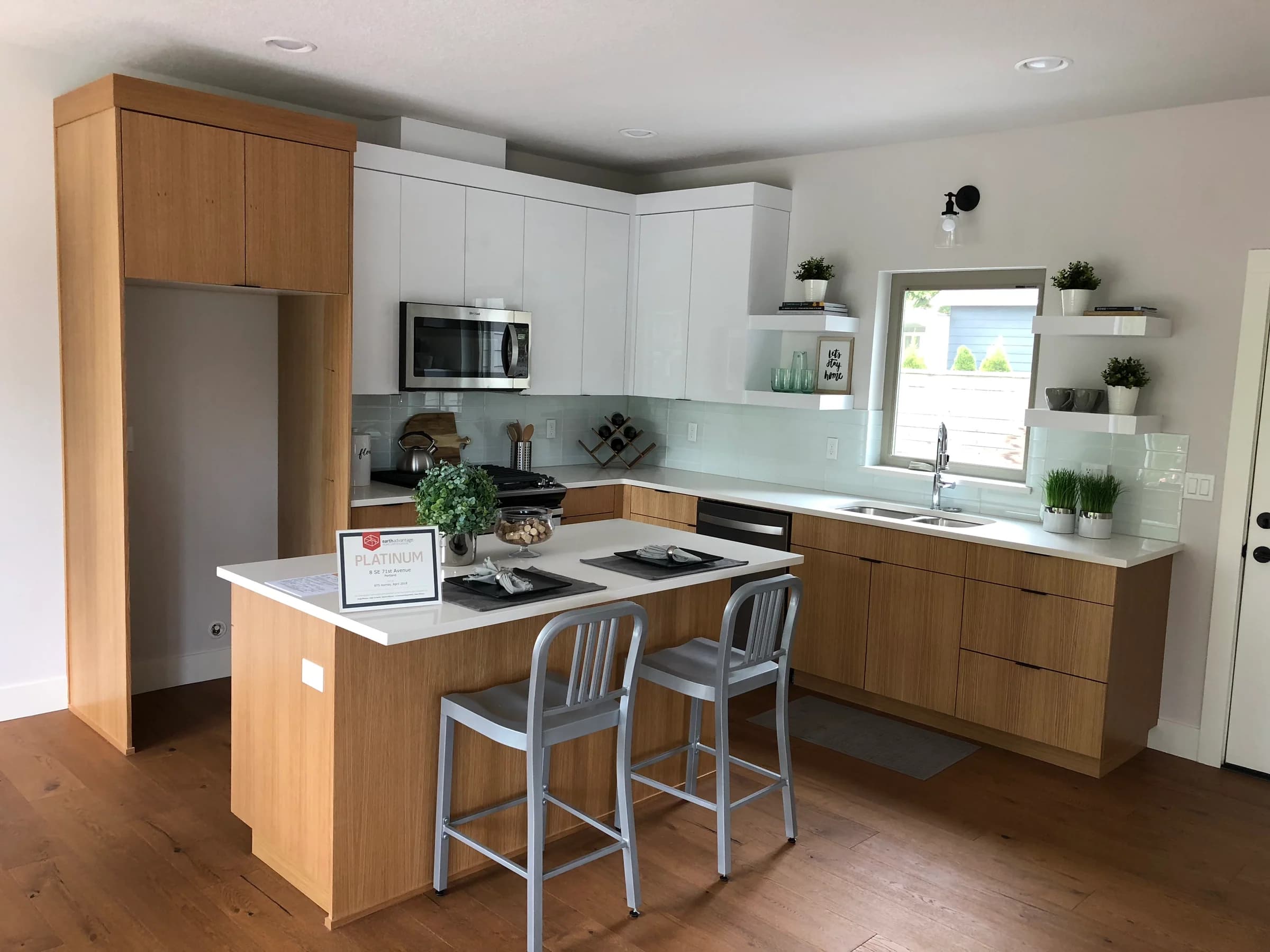 NS Wood Finishing project: wood base cabinets and a wood island paired with white upper cabinets