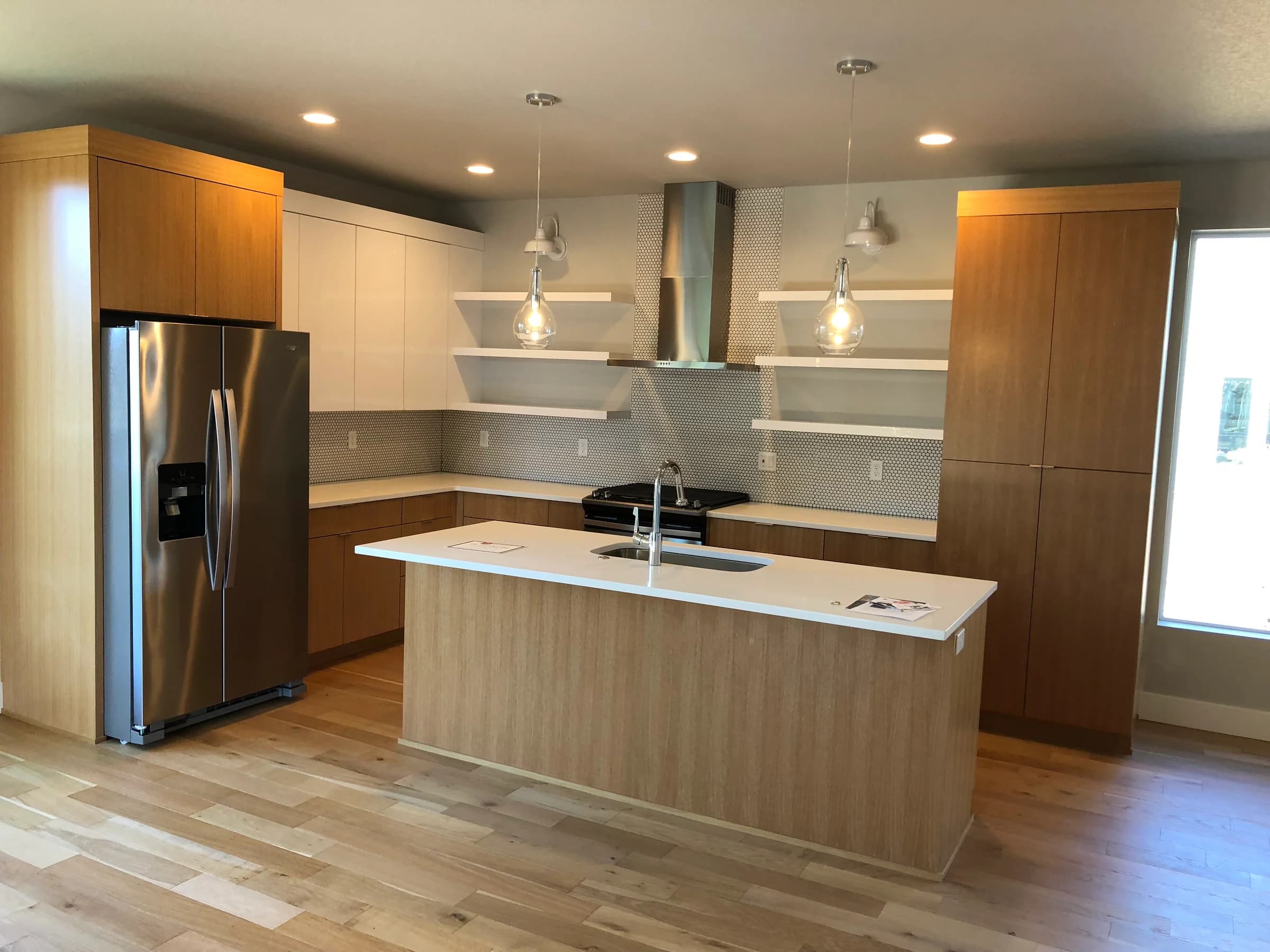 NS Wood Finishing project: wood kitchen cabinets and an island paired with white upper cabinets